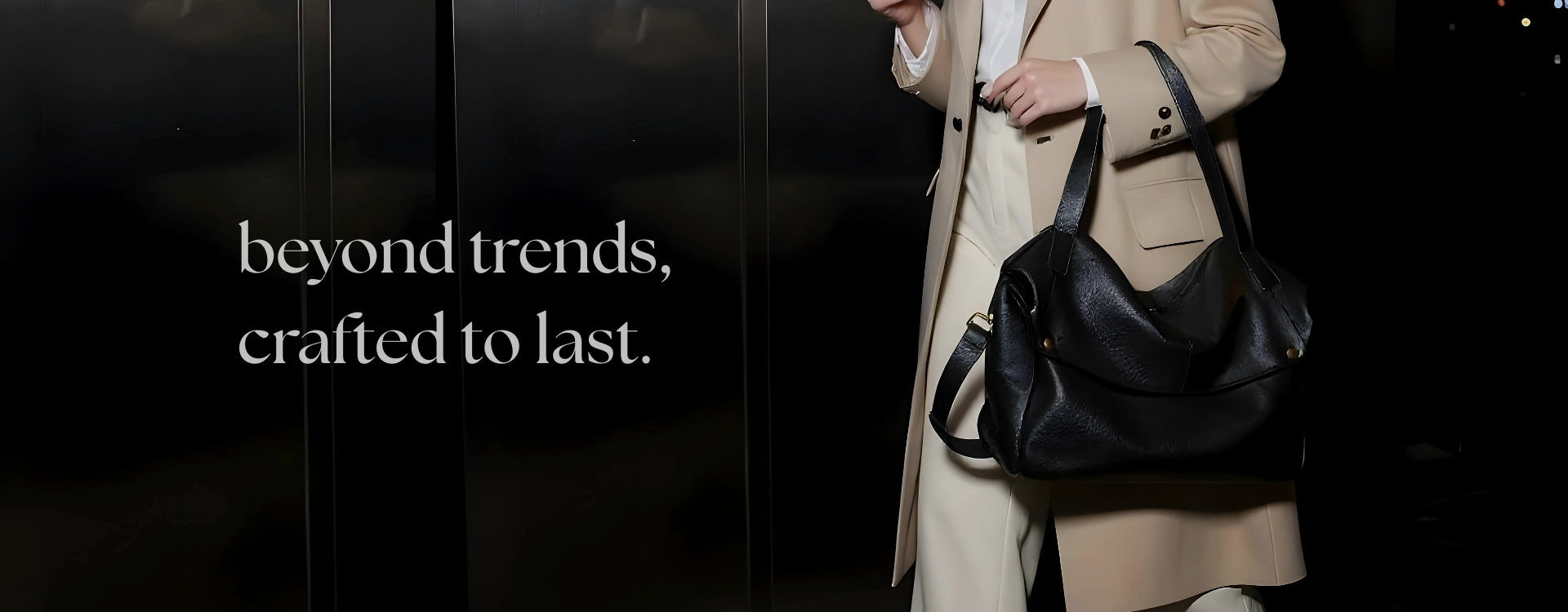 Person holding a black handbag with text 'beyond trends, crafted to last.' on a dark background
